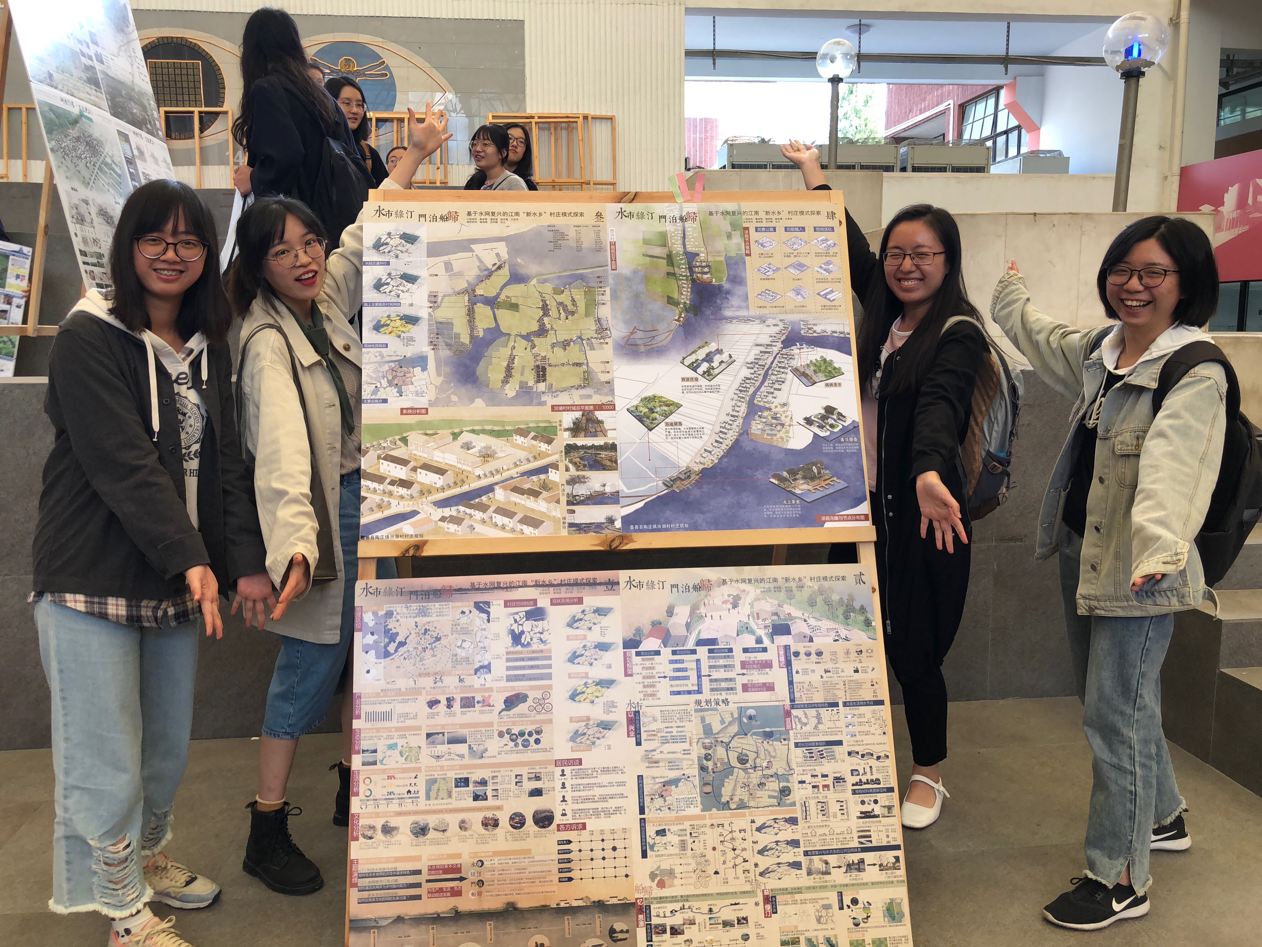 I took part in the national Urban and rural Planning and Design competition in my junior year and won the second place. Members took photos with their designs in the photo