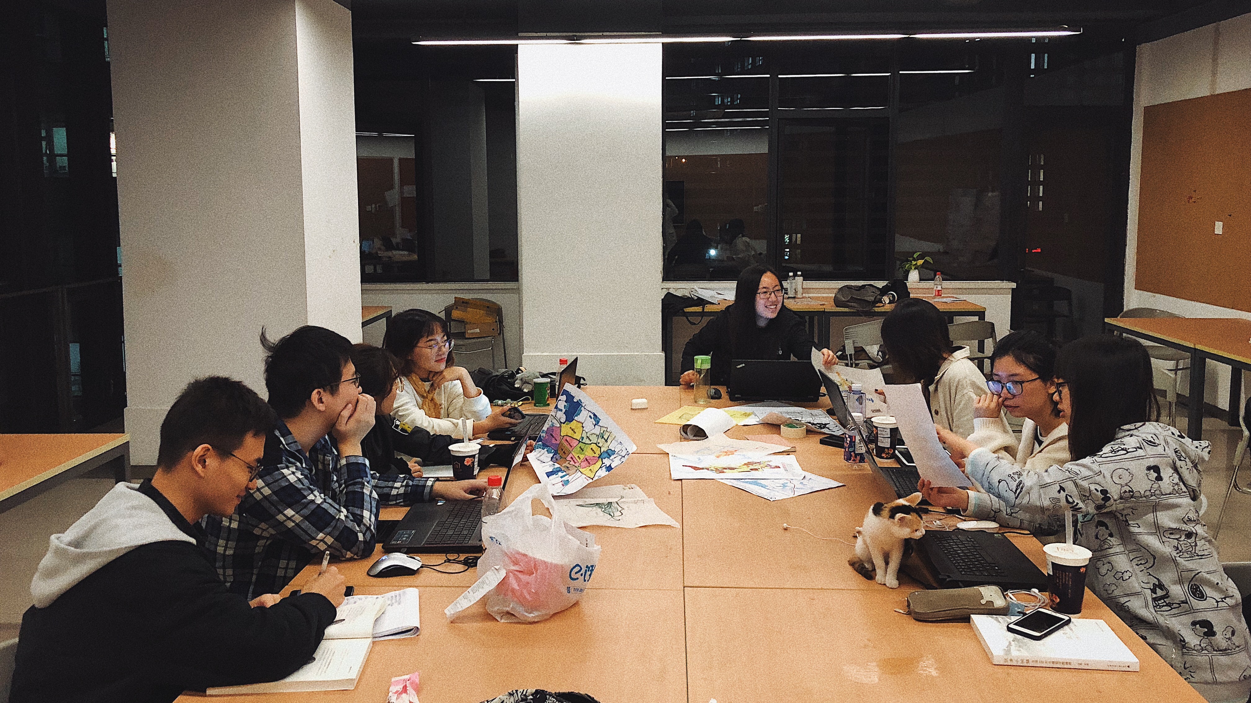 The scene where the team members sit in the classroom and discuss their plans together